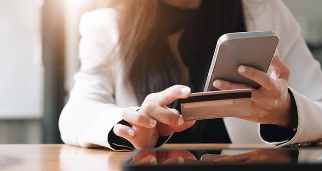 woman with credit card and mobile phone