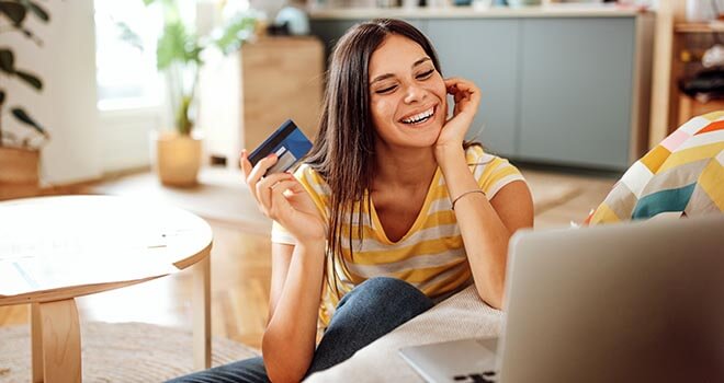 woman holding debit card